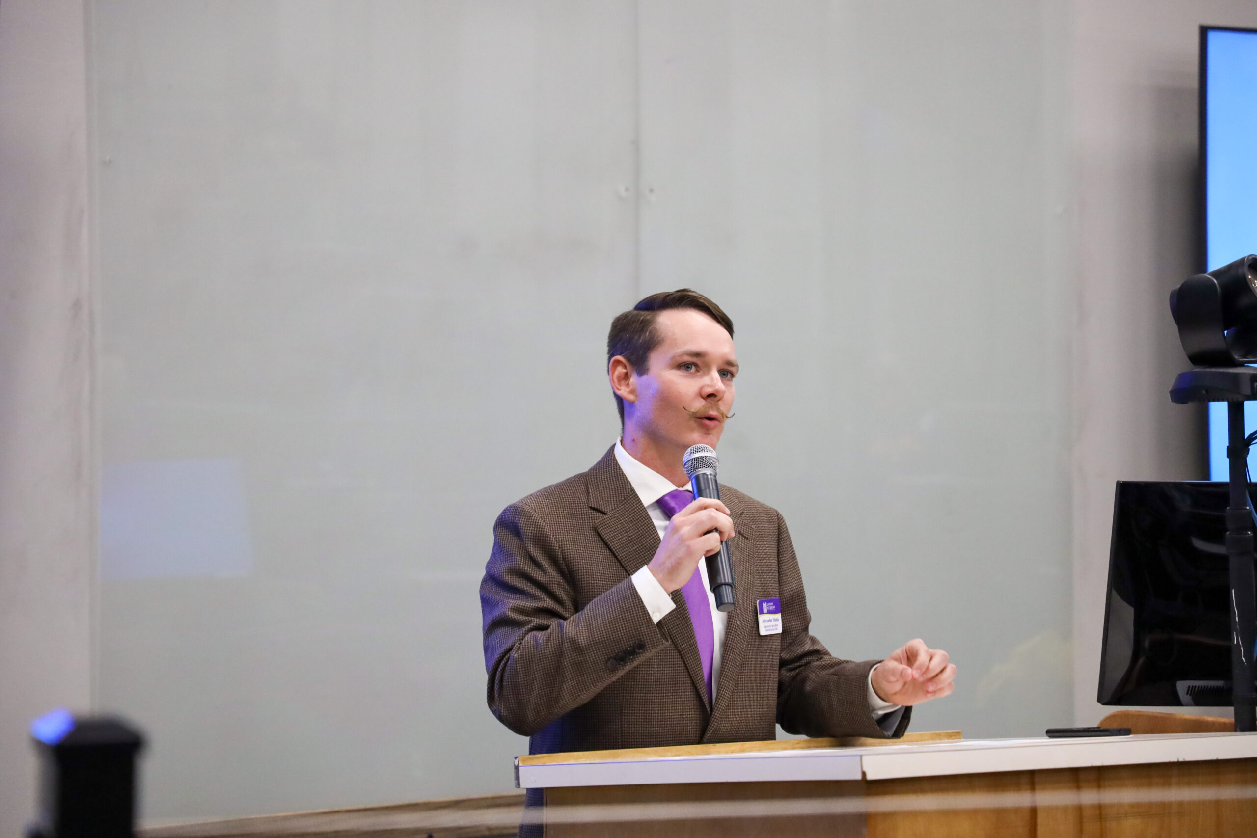 Man speaking in front of classroom