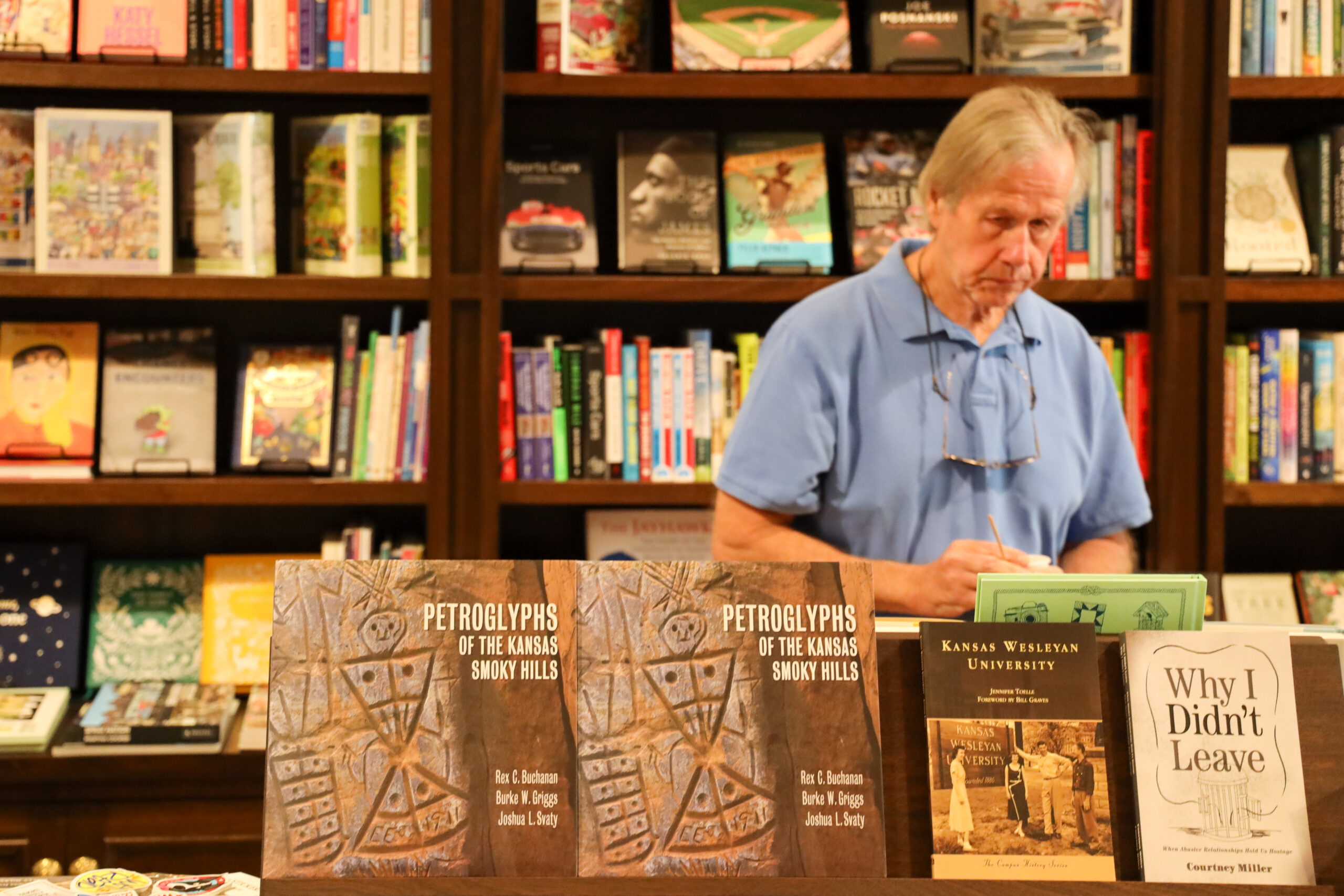 Man standing behind bookstore display