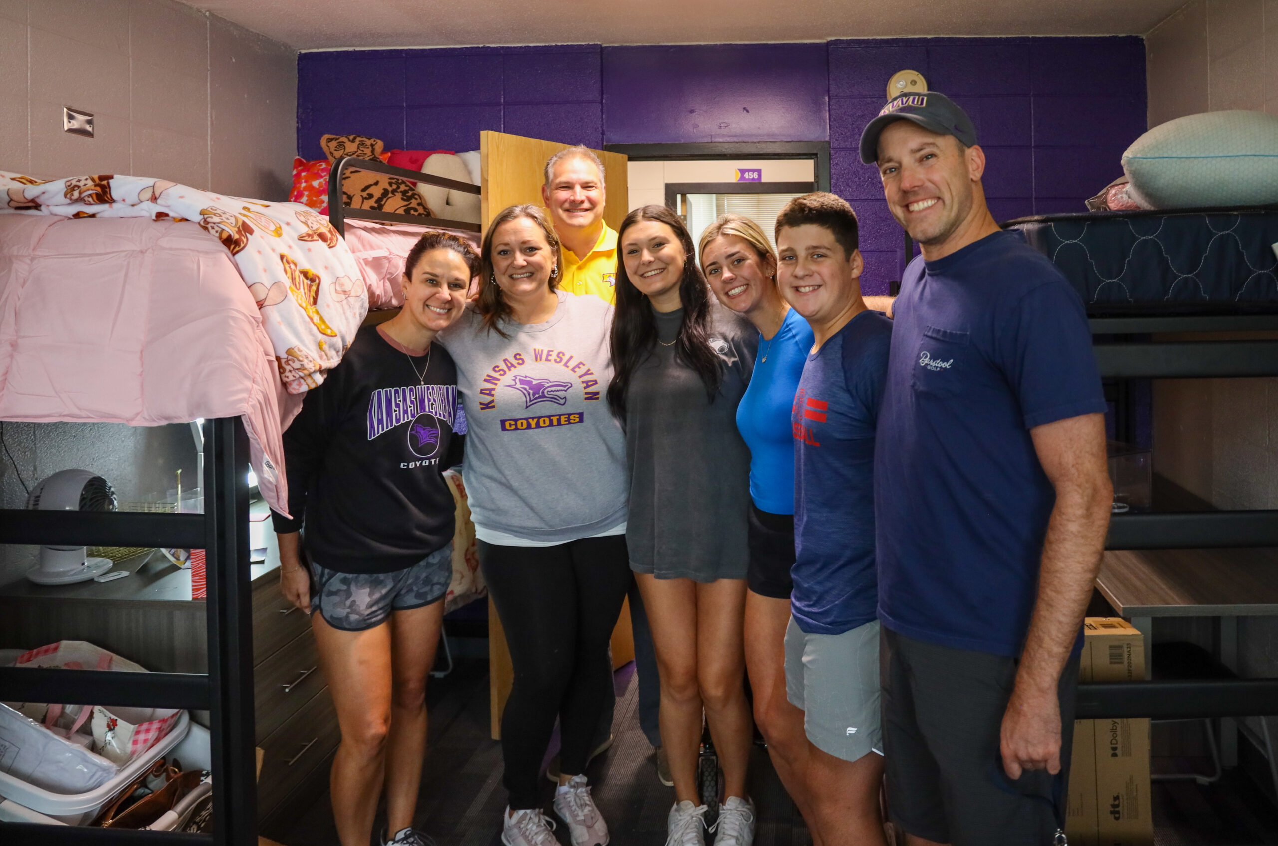 Group of family members in dorm room