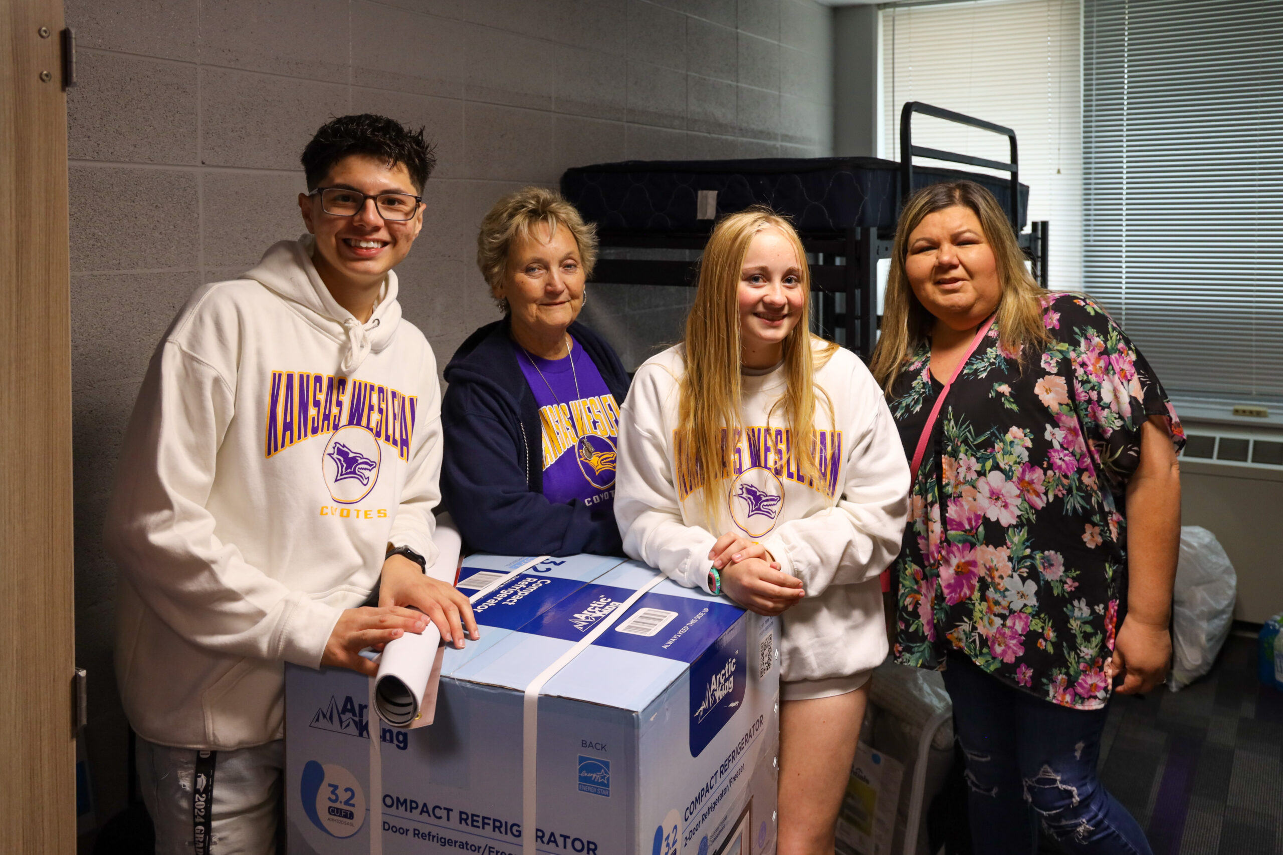 Group of individuals moving into dorm