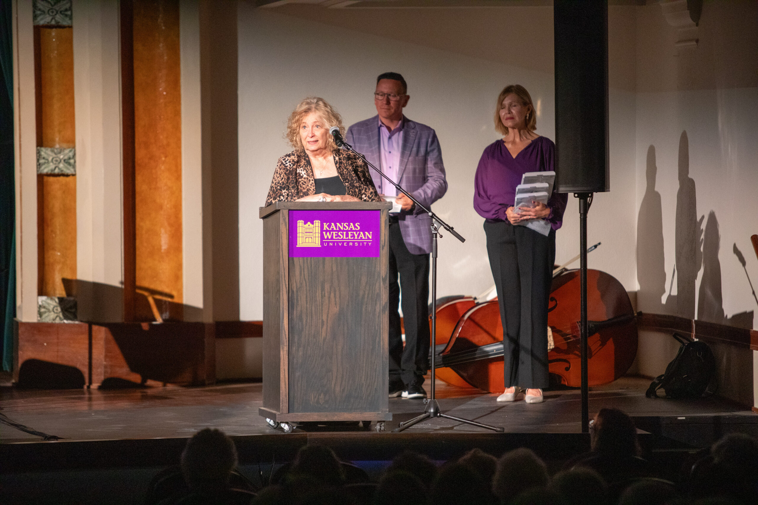 Two individuals at podium for award