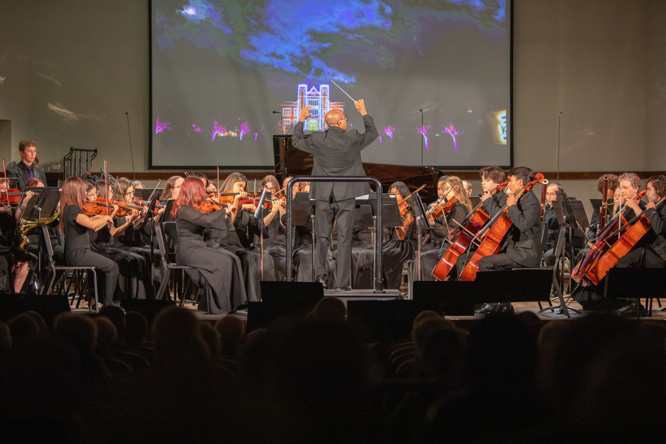 Man directing orchestra