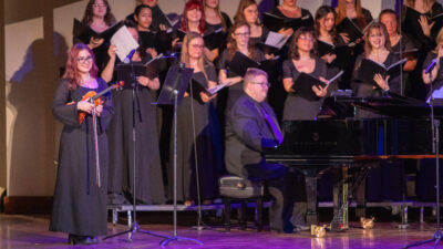 Piano player and choir singing