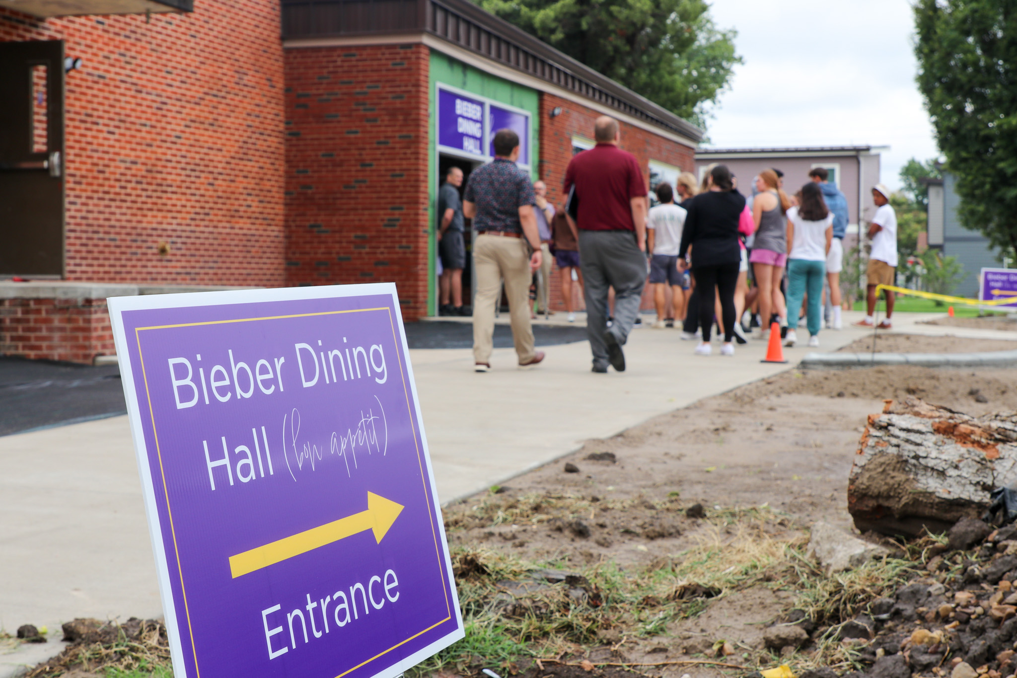 Dining hall entrance sign, people walking