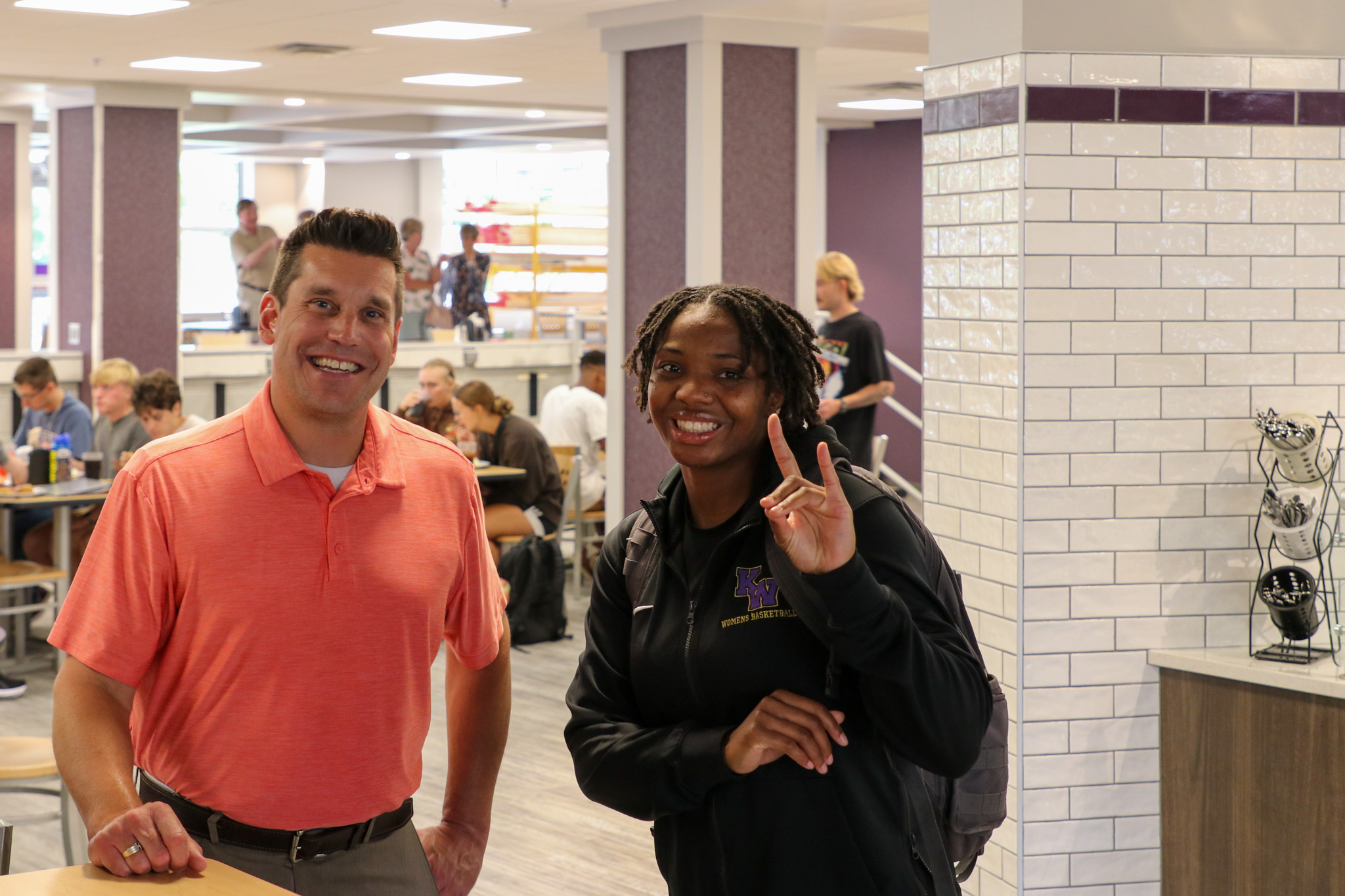 Student and admin inside dining hall