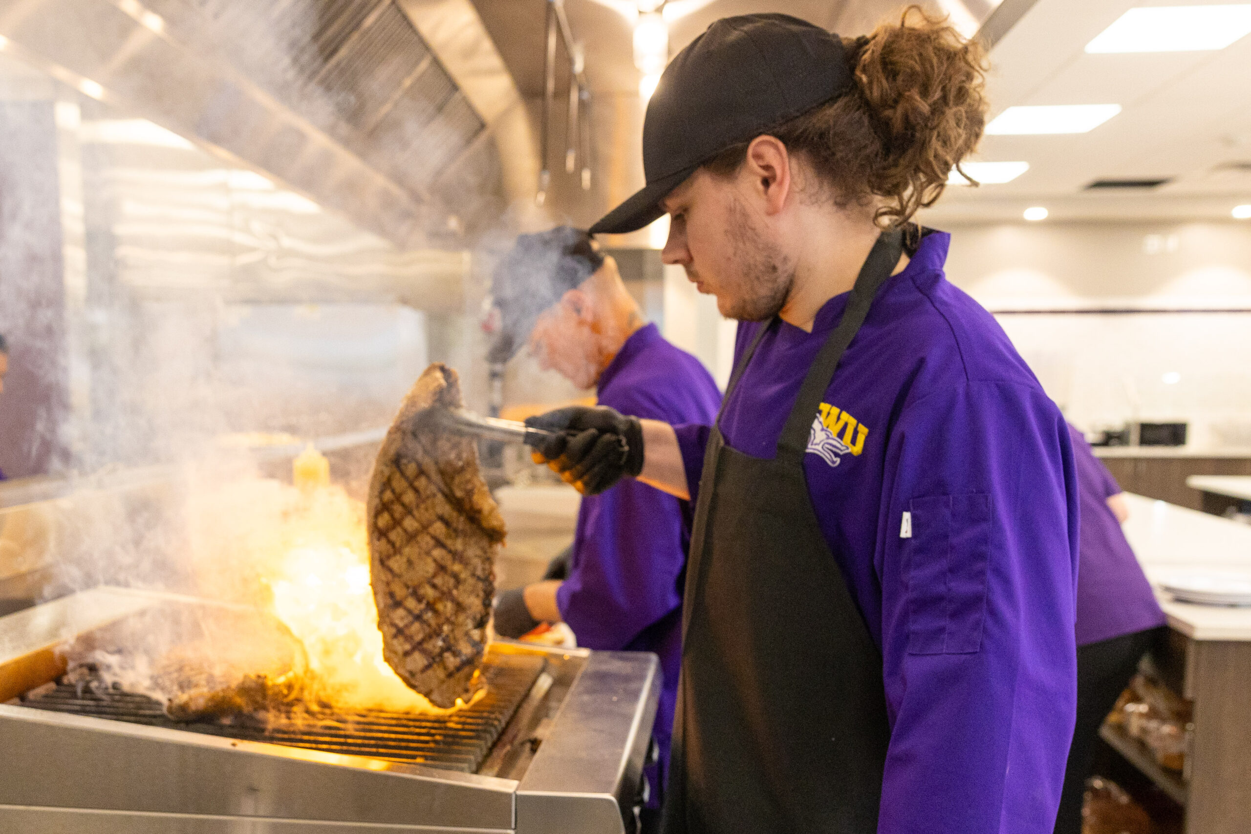 Man cooking chicken