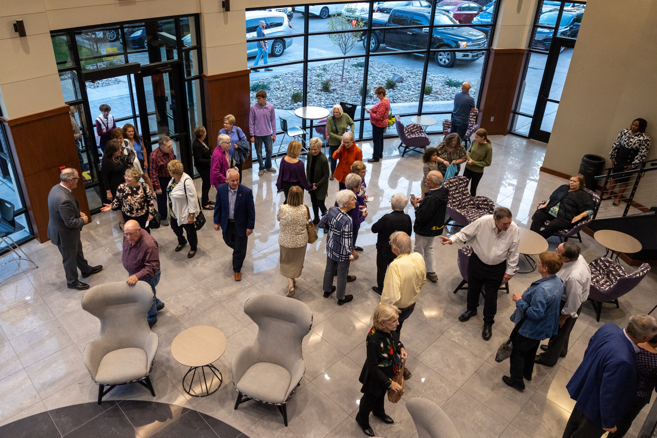 Individuals milling around inside Bieber Hall